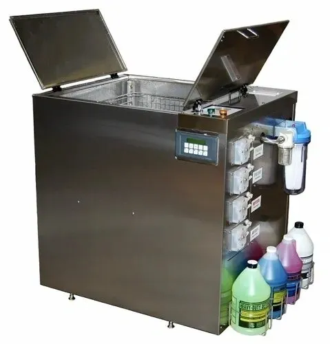 Industrial parts washer with cleaning solutions.