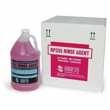 Here are a few alt text options under 8 words: * **RP355 Rinse Agent, Georgia Steel** * **Georgia Steel RP355 Rinse Agent** * **Pink rinse agent in jug and box** I prefer the first two options as they are more descriptive of the product. The third is more generic but acceptable if a precise description is not crucial.