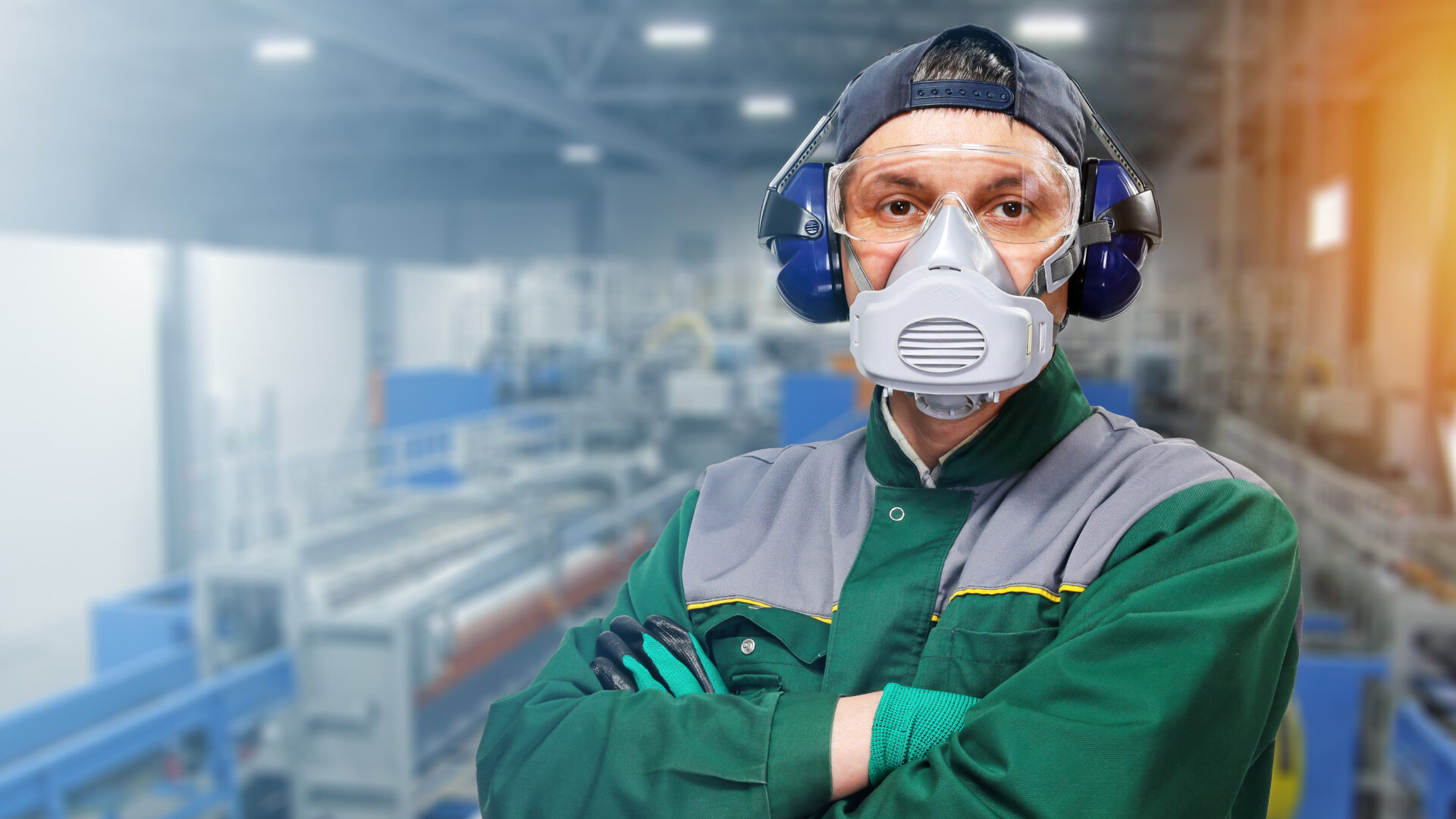 Factory worker wearing safety gear.